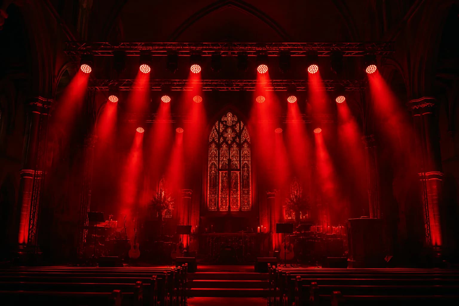 Live entertainment venue illuminated with red moving head wash beams
