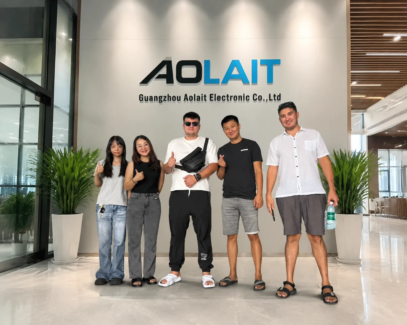 Professional lighting visitors and AOLAIT team members at the Guangzhou company reception