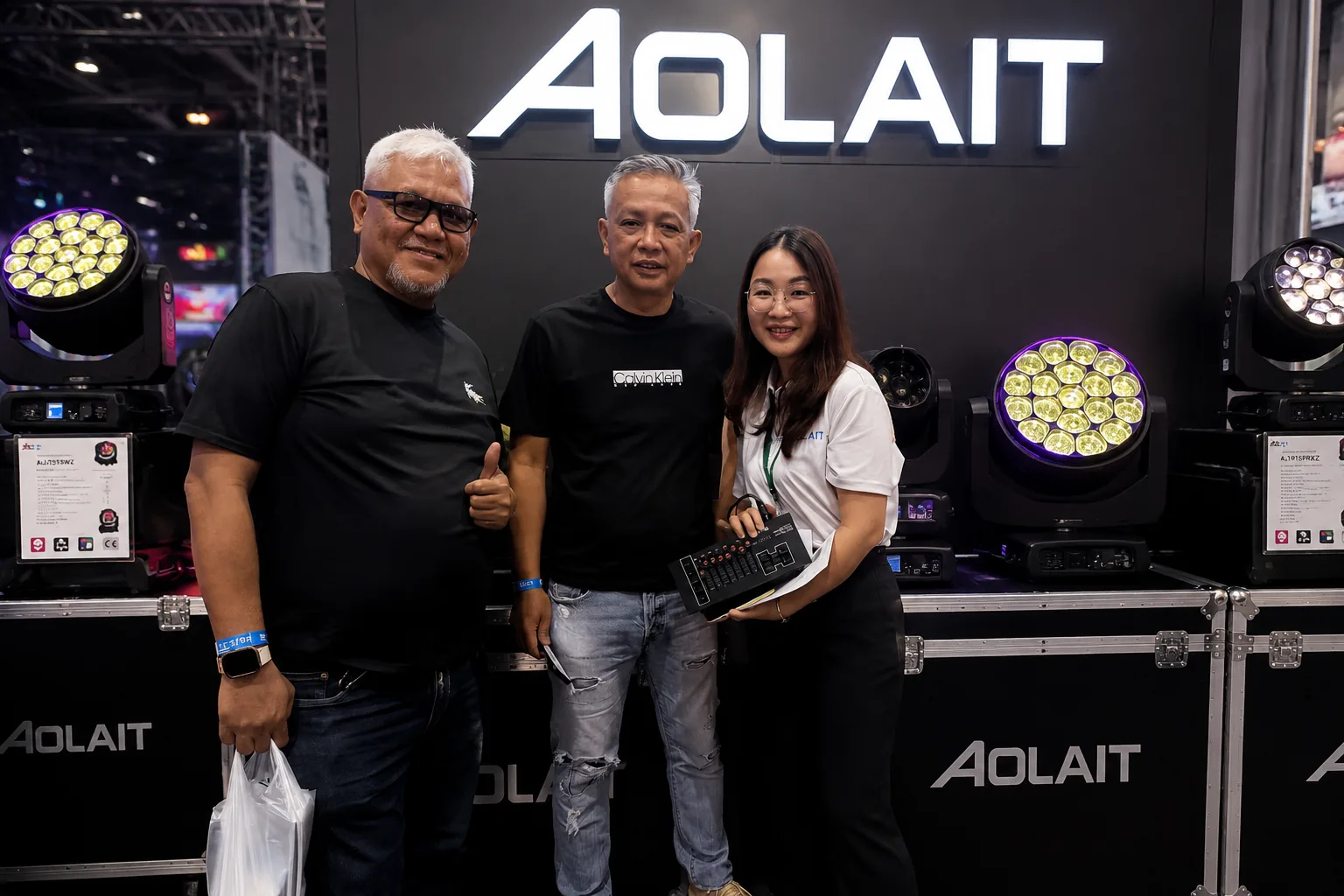 AOLAIT representative presenting moving head lighting products to exhibition visitors
