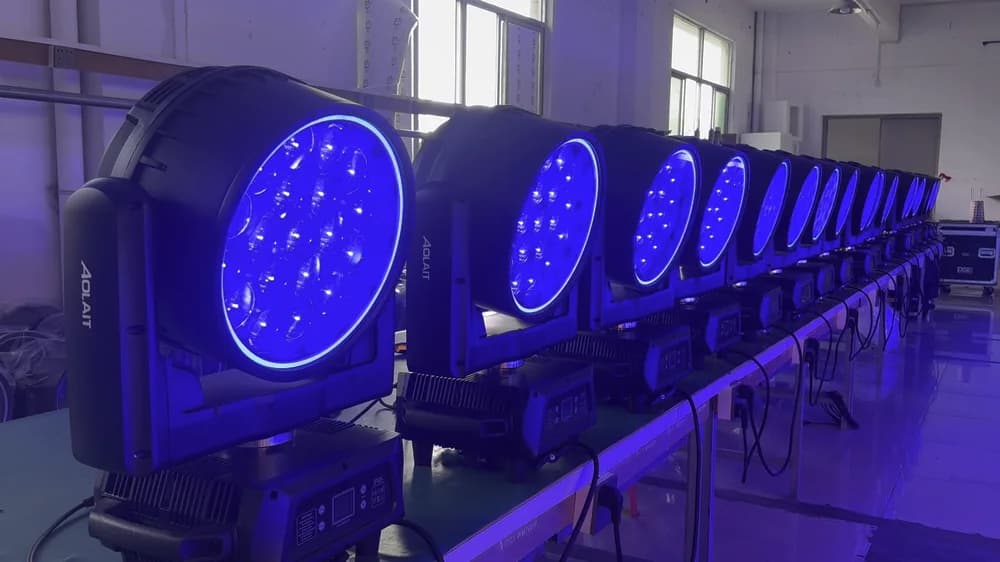 AOLAIT moving heads operating with blue output in a factory test row