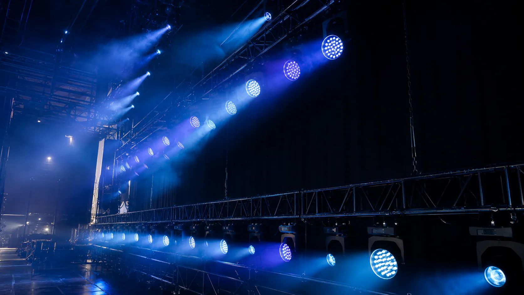 Blue LED moving head fixtures arranged on stage trusses for market application planning