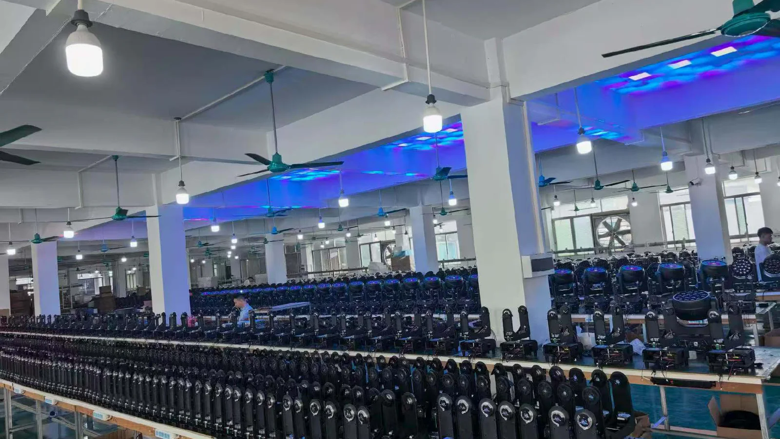 Rows of powered moving heads on the Aolait factory test floor