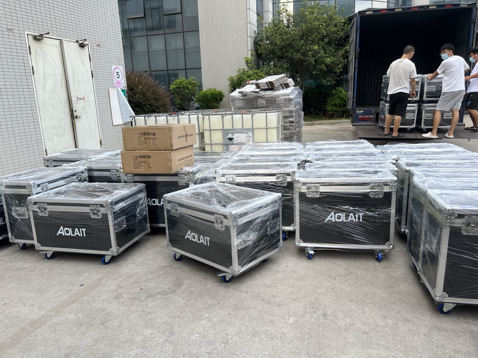 Aolait-branded flight cases wrapped and arranged for shipment loading