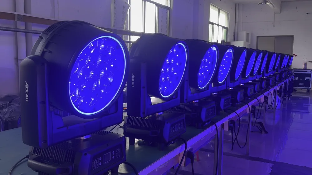 AOLAIT moving heads operating with blue output in a factory test row