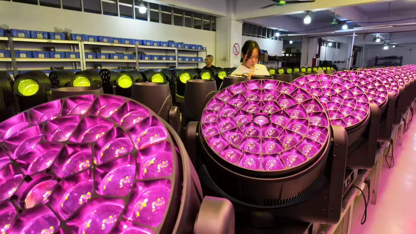 Aolait team inspecting LED wash moving heads during production